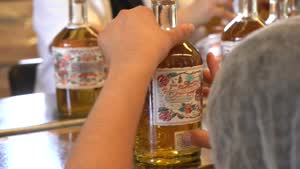 The bottling team applying Siempre labels